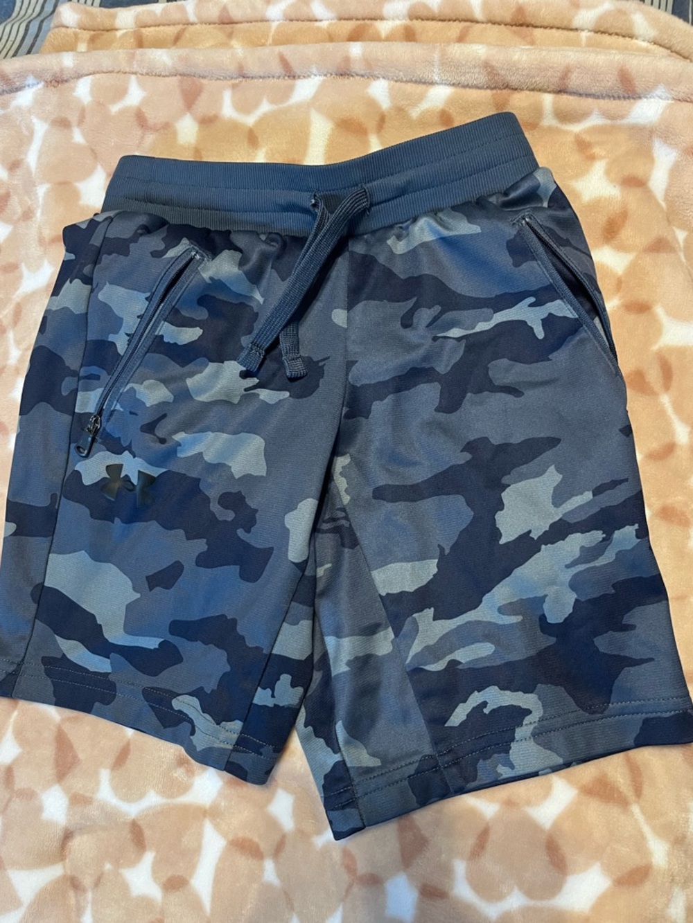 Under Armour 
Boys blue camo shorts